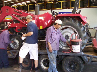 Inserting tire seal into large tractor